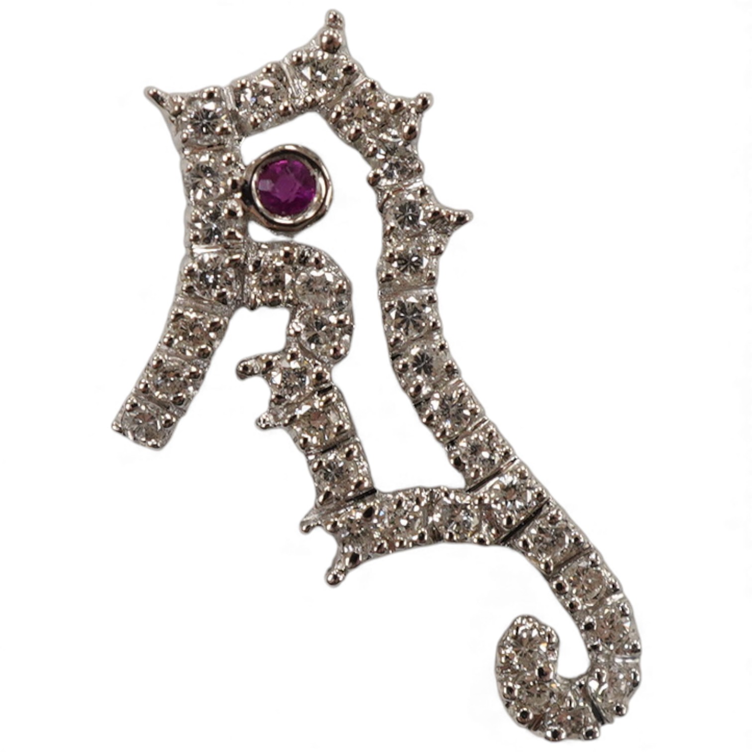 A recent 18k white metal diamond cluster set seahorse charm/pendant, with single stone ruby set eye, 19mm.